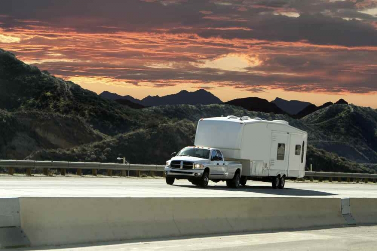 RV on the road at dusk